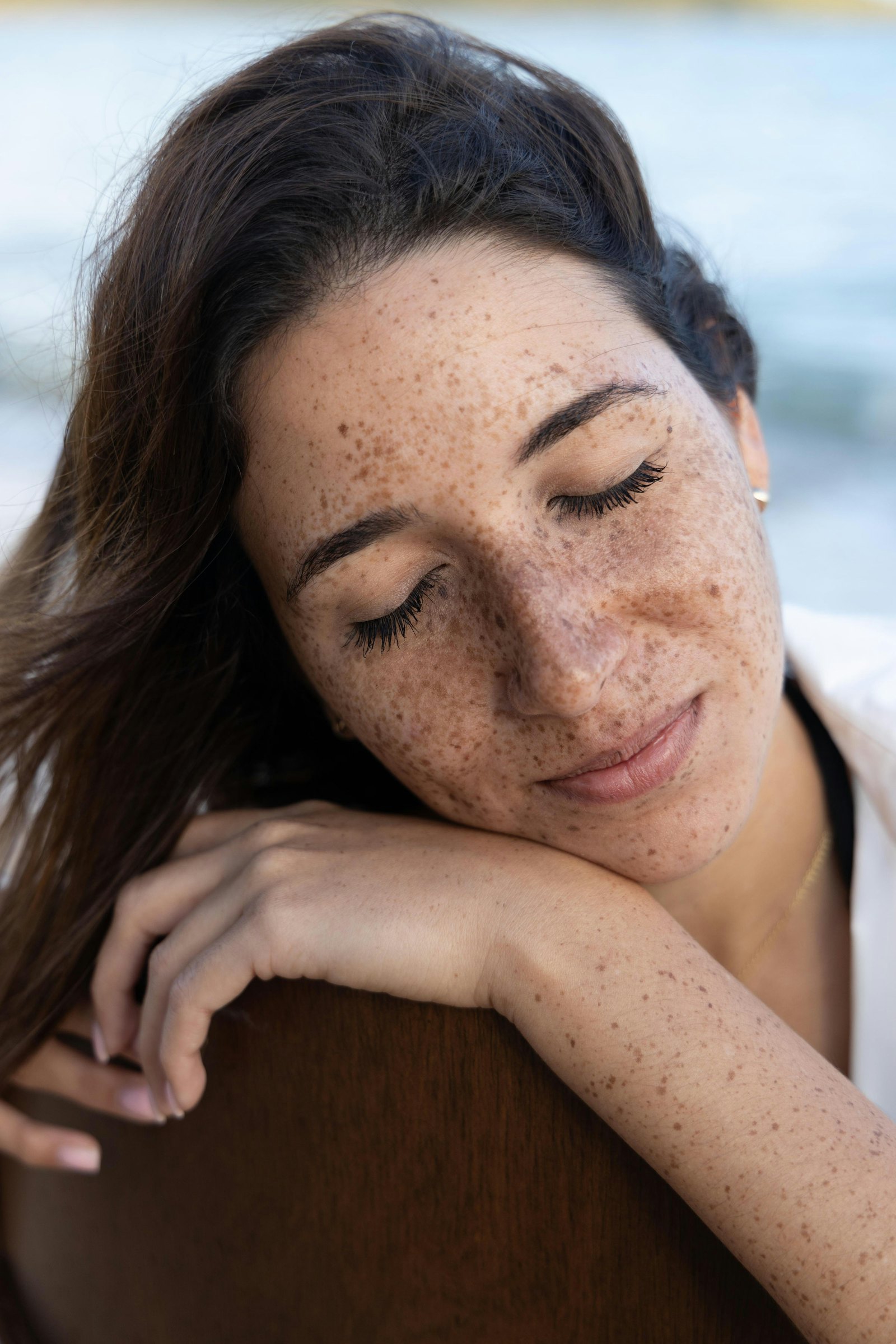 A woman resting peacefully with her eyes closed